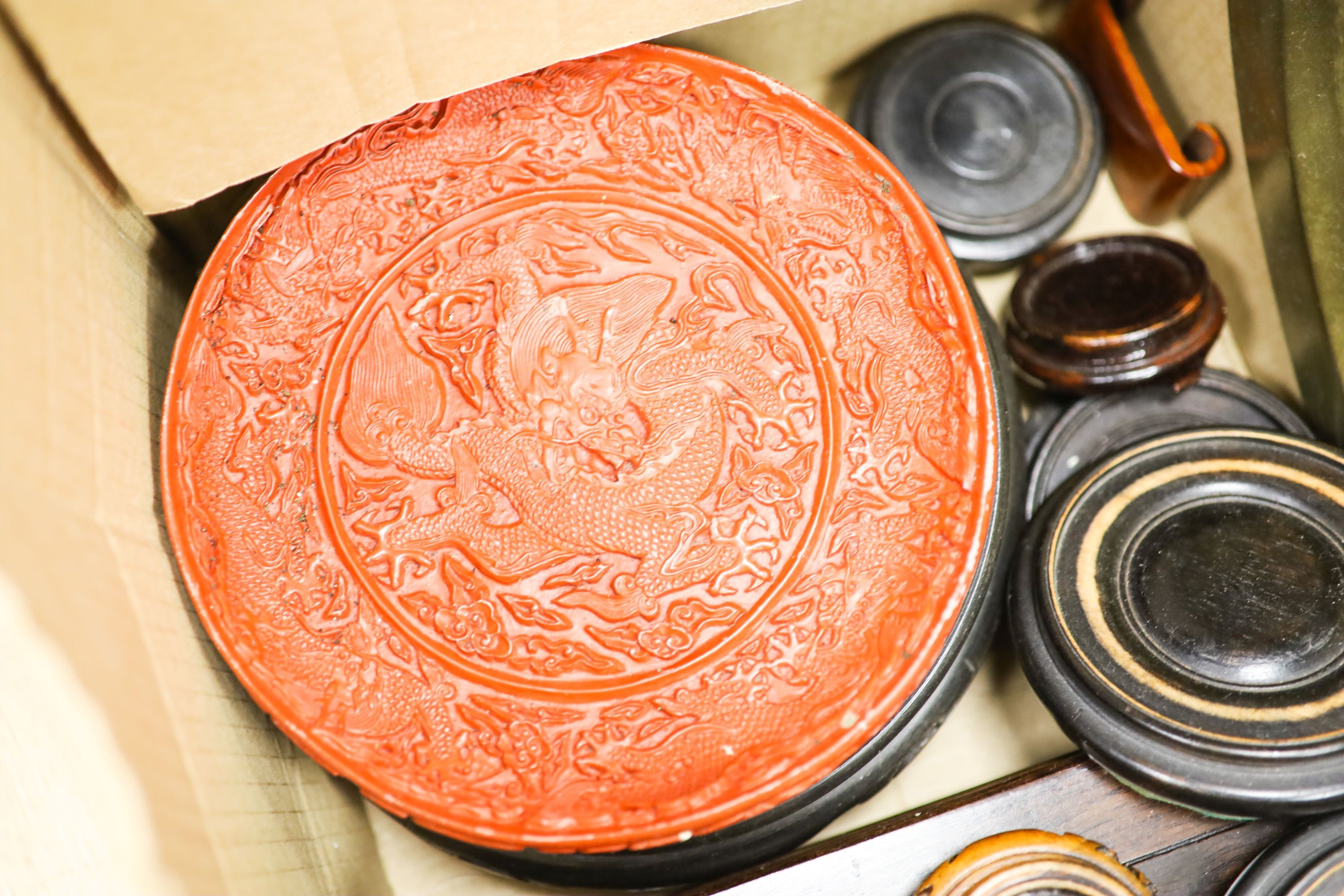 Assembled Chinese wooden stands and simulated cinnabar dish with sign